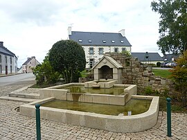 The modern fountain, with the town hall in the background, in Collorec