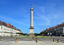 Large column with a statue of Louis XVI on top