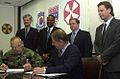 Image 16National Federation of Federal Employees officials sign a collective bargaining agreement with the U.S. 8th Army in October 2002.