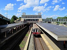 Outbound Braintree Branch train at JFK UMass station, July 2013.JPG