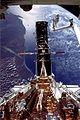 Hubble space telescope docked to Space shuttle for repair