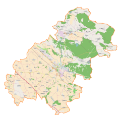 Mapa konturowa powiatu oławskiego, blisko prawej krawiędzi nieco u góry znajduje się punkt z opisem „Biskupice Oławskie”