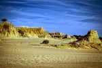 Sandy dunes with rocky outcrops