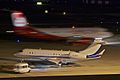 left side bit rear at night with an AirBerlin airbus moving behind