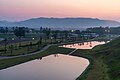 * Nomination Pink sunrise over ponds in the Tumuli Park of Gyeongju Historic Site Wolseong District. Contre-jour view from a hill, in South Korea. --Basile Morin 04:30, 5 November 2024 (UTC) * Promotion  Support Good quality. --Jakubhal 05:12, 5 November 2024 (UTC)  Support Good quality. --Johann Jaritz 05:22, 5 November 2024 (UTC)