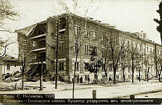 A tobacco warehouse with its sides damaged,