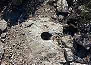 A posthole dug by the Hohokam inside their house. The Hohokam placed heavy mesquite or pine posts on them to support a roof.