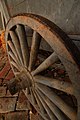 An iron-tyred wooden-spoked cart wheel