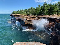 Waves crashing into a rocky shore