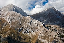 A mountain range with steep cliffs and peaks.