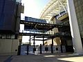 Gates now dwarfed between and beneath the south and east stands