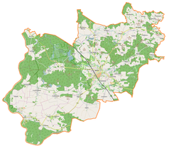 Mapa konturowa gminy Wołów, w centrum znajduje się ikonka pałacu z opisem „Zamek w Wołowie”