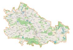 Mapa konturowa powiatu lubartowskiego, po lewej nieco na dole znajduje się punkt z opisem „Parafia Matki Bożej Szkaplerznej”