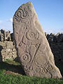 Men Aberlemno ow tiskwedhes arwodhow piktek, (dhyworth an wartha dhe’n woles) an sarf, an blasen dhewplek ha’n gweder mires ha krib