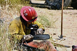 Firefighter Maintaining Chainsaw Willow Fire 2021.jpg