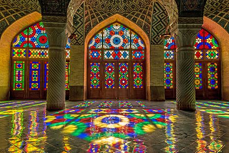 A view of the interior of Nasir ol Molk Mosque located in Shiraz. The mosque includes extensive colored glass in its facade that make beautiful colors when light is passed through them and is reflected on the carpets. Photograph: Hesam.montazeri Licensing: CC-BY-SA-4.0