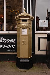 The Olympic gold Penfold pillar box in Lincoln.