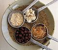 Elements of the fruit pulp (clockwise from top right): chunks, fibers, seeds, and pulp powder