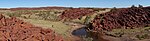 Landscape with a stream and piles of rocks