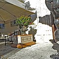 Statue and planter in front of entrance door