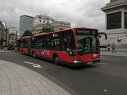 Articulated bendy bus in Trafalgar Square on London Buses route 12.