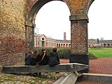 View of the oval courtyard and the statue of H. de Gorge, who early in the 19th century built the mining complex of Grand Hornu, which is an example of functional town-planning and evidence of the importance of the Industrial Revolution in Wallonia.