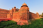 Fortress walls and a gate in red stone