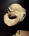 Miệng máng xả nước dạng mặt nạ hài kịch Hy Lạp ở Ai Khanoum. Thế kỷ thứ 2 TCN.