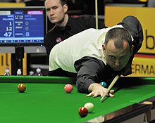 Mark Williams playing a shot