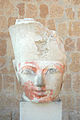 A stone head, depicting Hatshepsut, wearing a crown