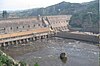 The downstream side of a concrete structure that is used to retain water and produce electricity