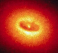 Giant Disk of Cold Gas and Dust Fuels Possible Black Hole at the Core of NGC 4261 (1992-27-81).tiff