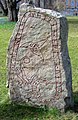 Triquetra and runes on one of the Funbo Runestones, located in the park of Uppsala university