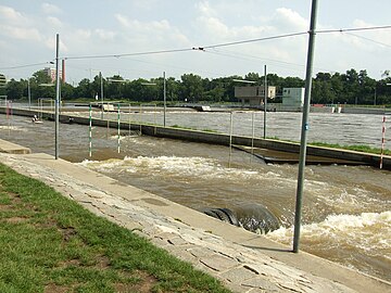 Foreground, the iconic truck tire water diverters. Background, the Troja dam on the Vltava river.