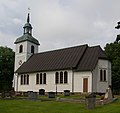 Hällestads stavkyrka, Västergötland. Dendrokronologisk datering cirka 1140. Riven på 1600-talet. Bilden visar den tredje träkyrkan från 1907.