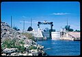 View ESE of Dike Canal Point locks and SCFE train bridge over the West Palm Beach Canal during US Army Corps of Engineers rehabilitation. Lake Okeechobee is behind the photographer. Canal Point, Florida, 1968.