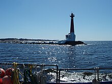 A medium shot of the Muskegon Pier Light of Lake Michigan