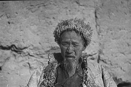 A Dongxiang Muslim wears a fur hat in the winter, Dongxiang County, Gansu, 1934.jpg