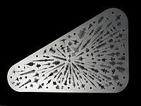 The outside of the Europa Clipper commemorative plate features waveforms that are visual representations of the sound waves formed by the word "water" in 103 languages