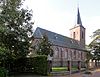 R.K. Sint-Odulphuskerk in neogotiesche stijl met kerkhof en calvarieberg