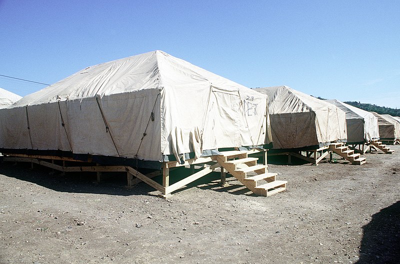 File:Strongback tents occupy Camp Oscar. Over 10,000 Cubans, now living in Panama, will arrive within the next month to live here. USN Seabees from Naval Mobile Construction Battalion-4 - DPLA - dcf304ad28acfcbbe8313fe8ef3b01bc.jpeg