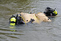 Underwater archeologists position a lift bag to readjust shoring during the excavation of the U.S. sloop-of-war Scorpion.