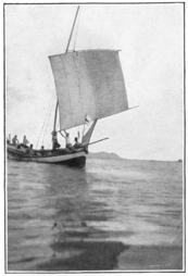 Roller-reefing the sail of a perahu payang.