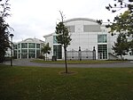 New building with preserved gates from the original entrance on Queen's Road