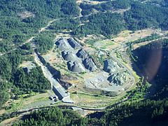 An aerial image of the notched Elk Creek Dam