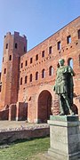 Turin Roman Palatine towers with statue of Julius Caesar 22-3-22.jpg