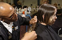US Navy 030515-N-5862D-038 U.S. Navy recruits get their first military haircuts at the Navy Exchange barbershop.jpg