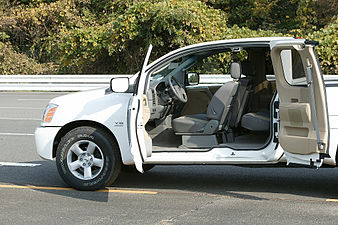 Nissan Titan showing the function of an extended cab's rear-hinged doors