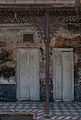 Cast iron column and arch opening with floral ornamentation (building #31, built in 1928 AD)