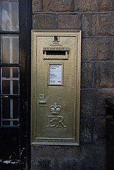 Gold large wall box at Disley Post Office, Cheshire.